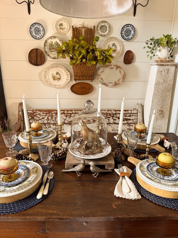 Blue and brown fall table with repurposed pheasant centerpiece and brass accents