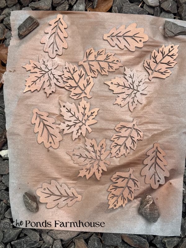 spray paint the wooden leaf cutouts.