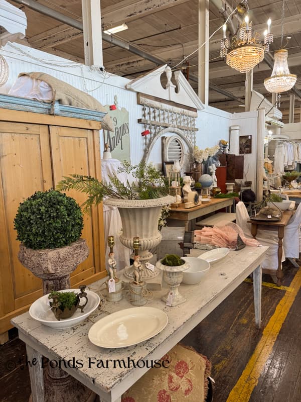beautifully curated antqiue mall booth with architectural elements