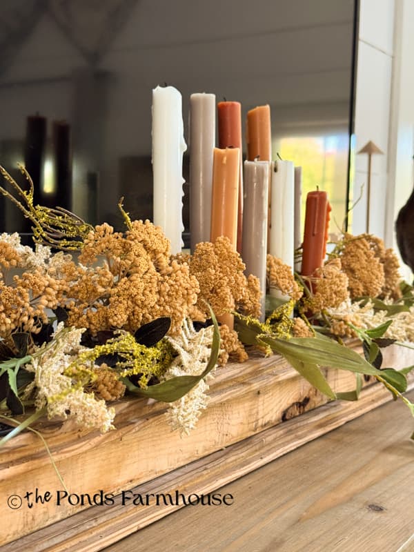 close up of layered dried stems and faux stems on DIY Wooden Candleholder