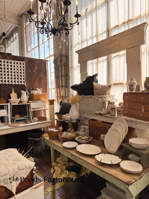 curated vintage booth with ironstone plates