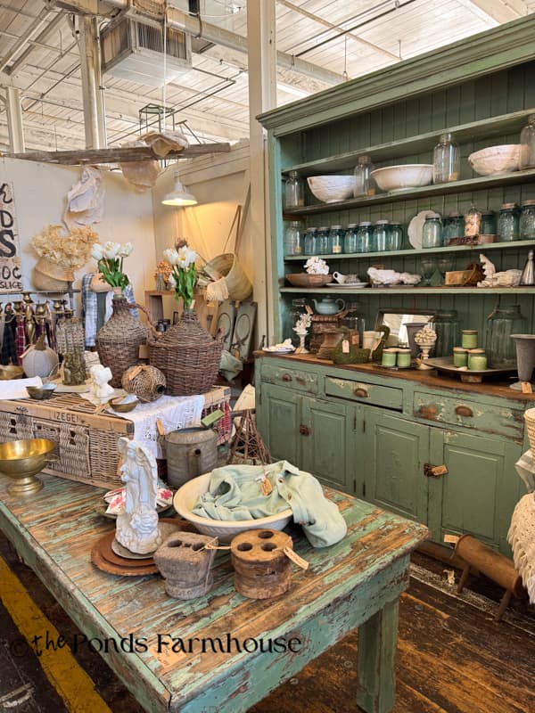 large green antique cabinet & vintage demi johns in lovely antique mall space