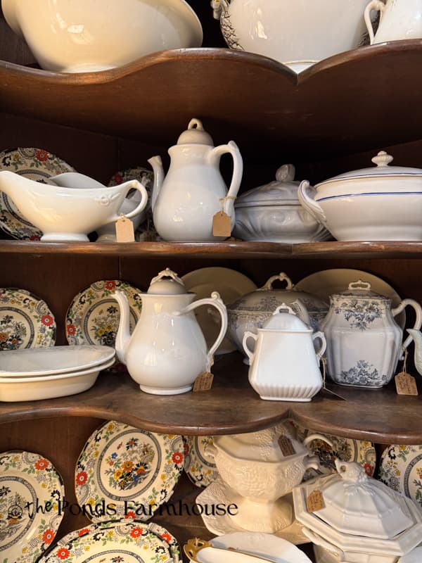 ironstone in a hutch in antique booth