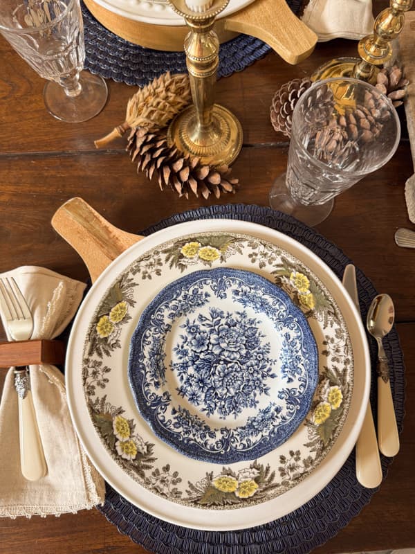 Thrifted blue and white dessert plate on brown dish for fall tablescape