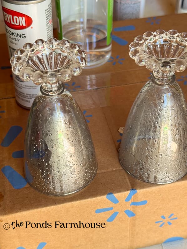 turn glasses upside down to drain spray paint.