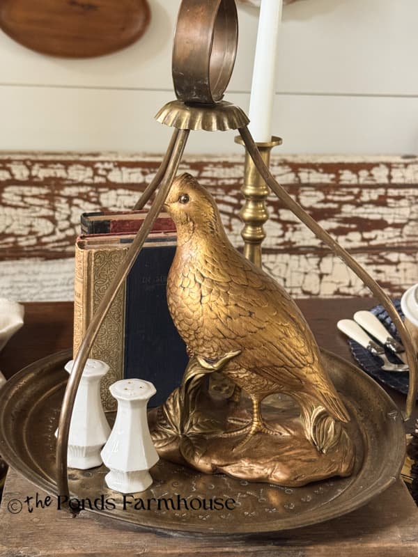 vintage turkish tray for table centerpiece with pheasant, old books and salt and pepper shakers