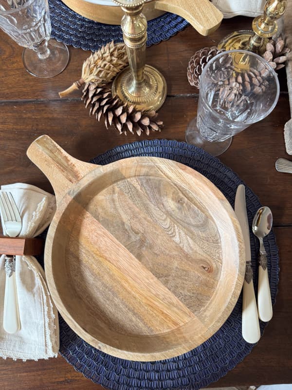 wooden plate charger on fall tablescape