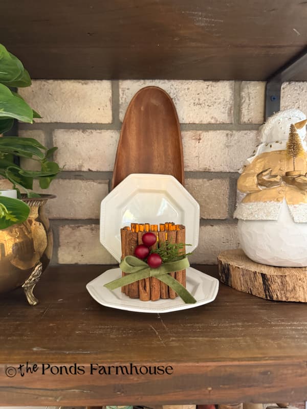 Cinnamon Stick Tea Light Candleholder with upcycled tin cans on open shelves