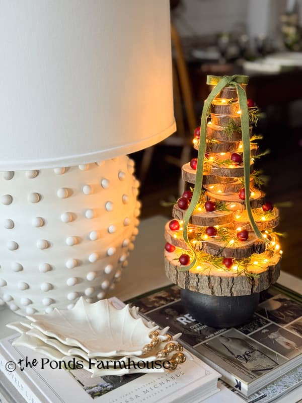 DIY Wood slice tree on side table with lamp and holly leaf bowls